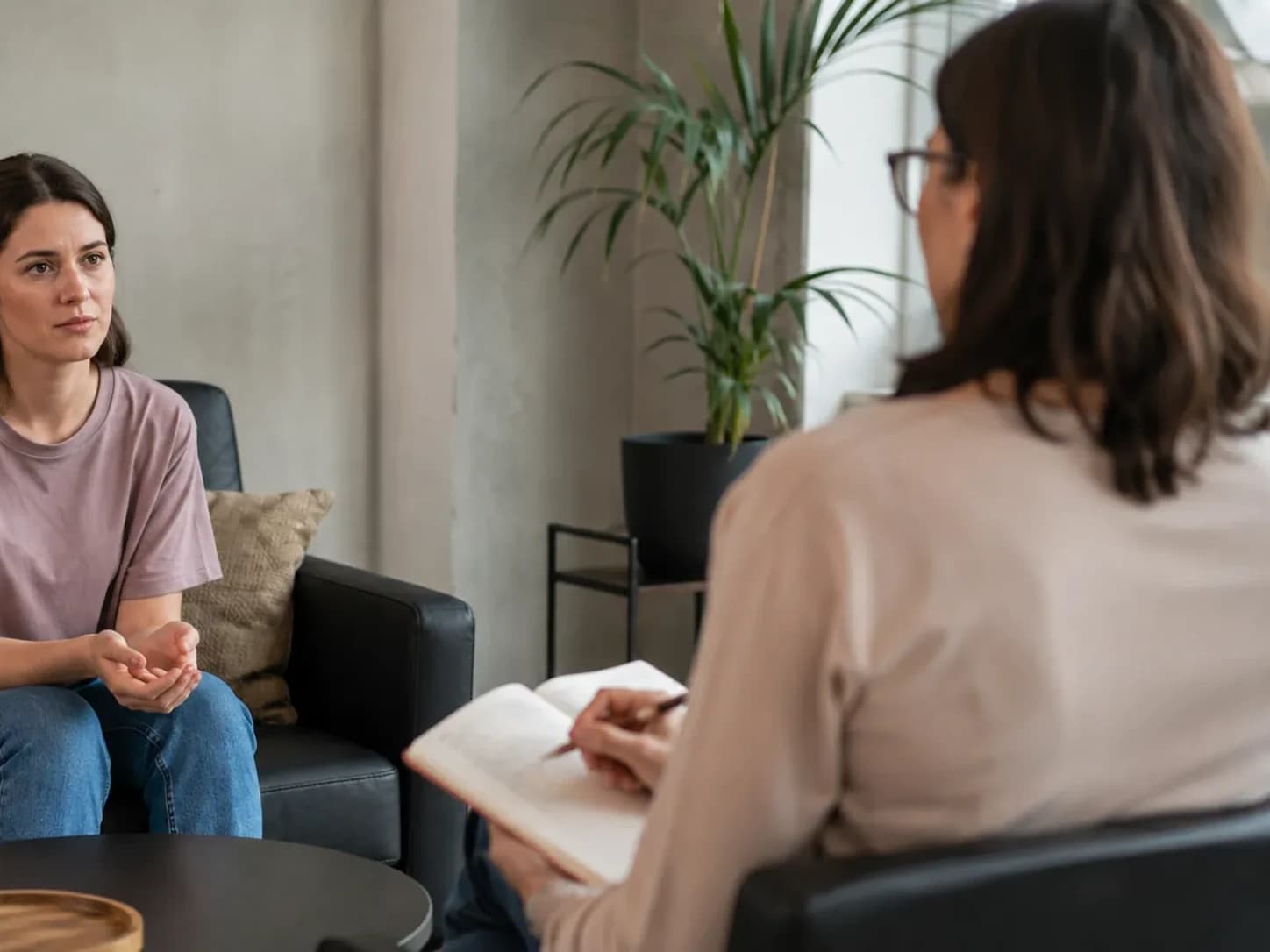 Client talking with a therapist in a one-to-one session