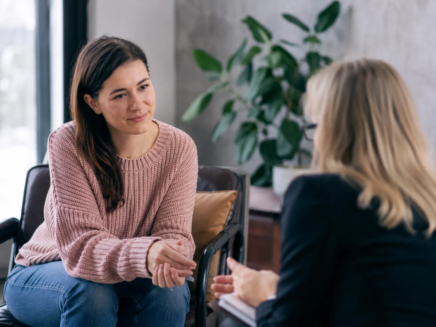 Client in conversation with a therapist